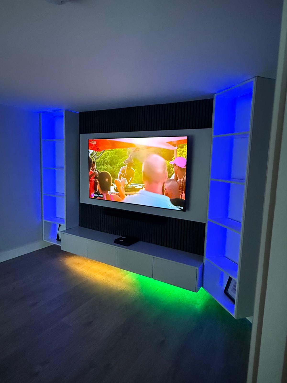 Black slatted television feature wall with linear fire, built by Max The Carpenter